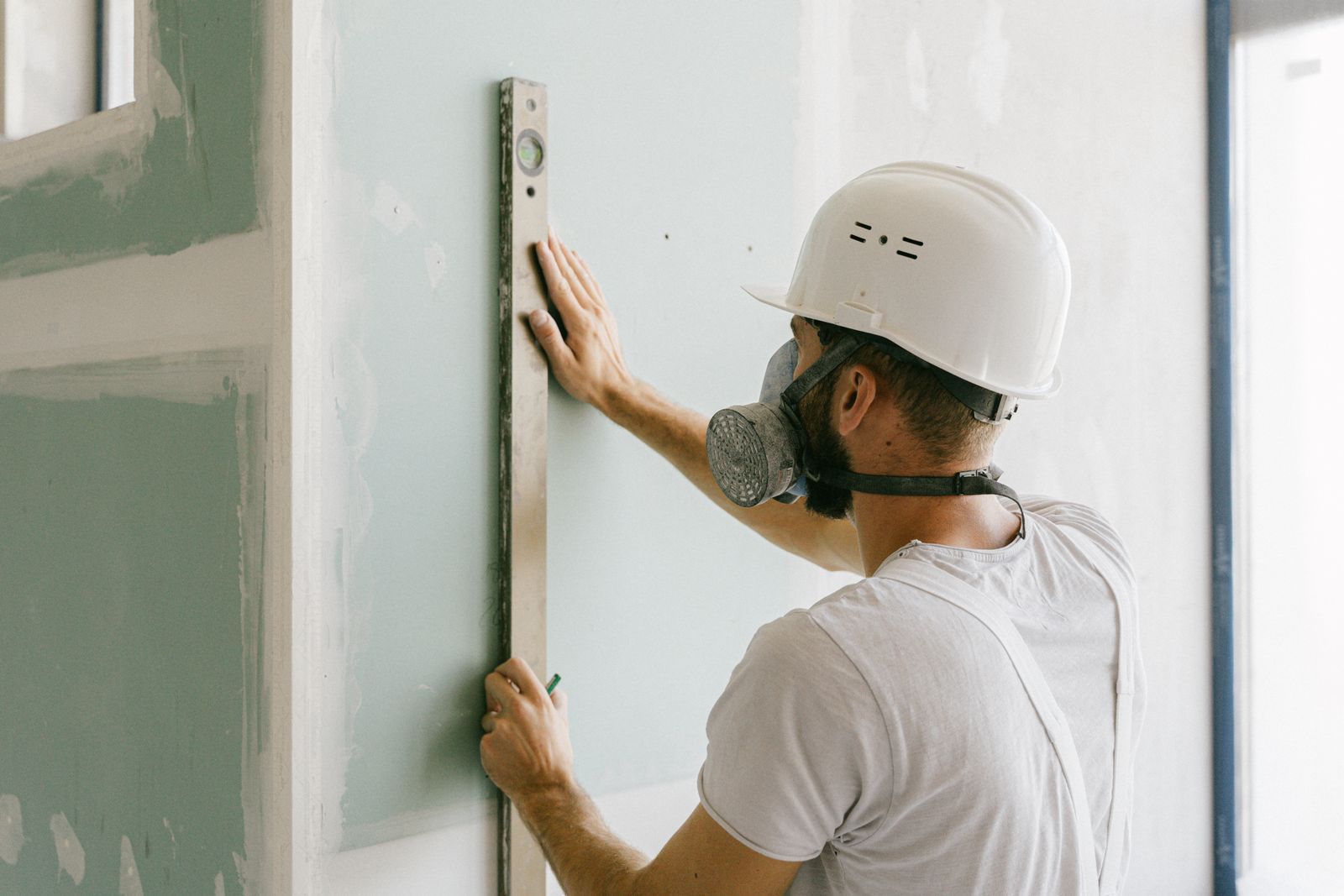 Checking a wall with a level