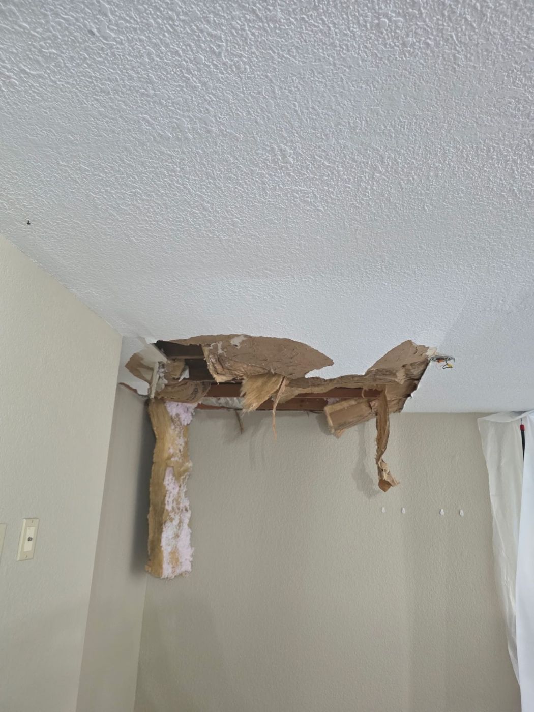 Ceiling collapsed by a water leak, before the repair