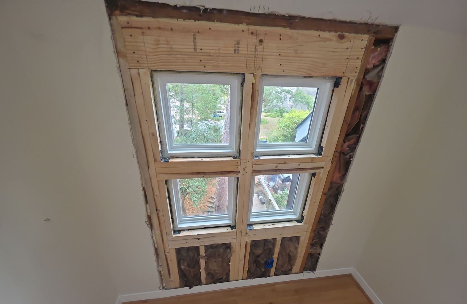 Wall opened and reframed for four new windows