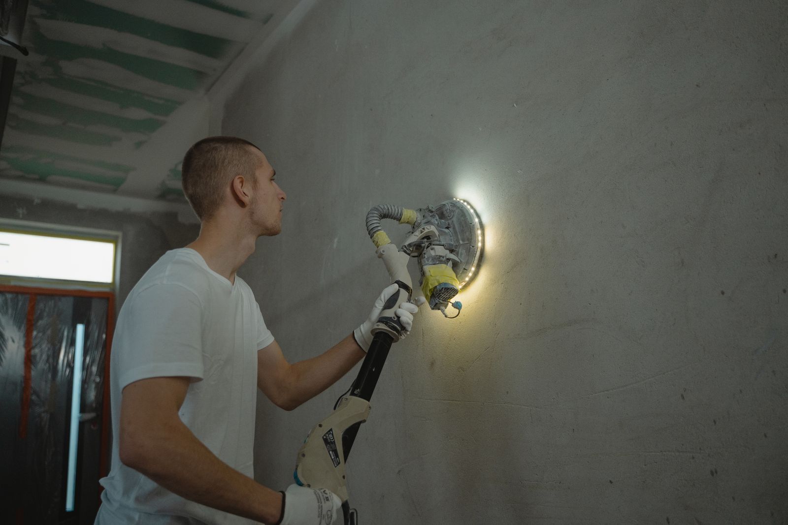 Power sanding a finished wall